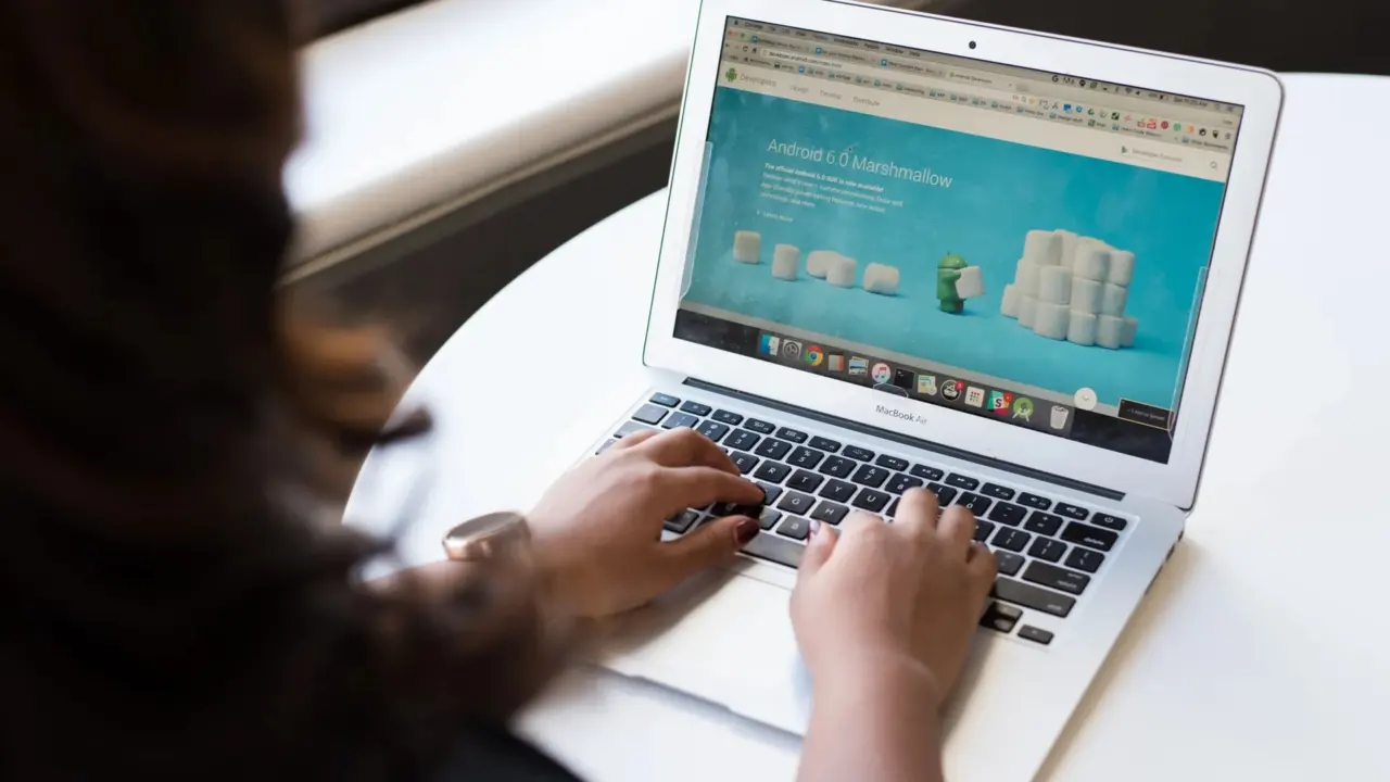 Shopper reading online product reviews on a laptop